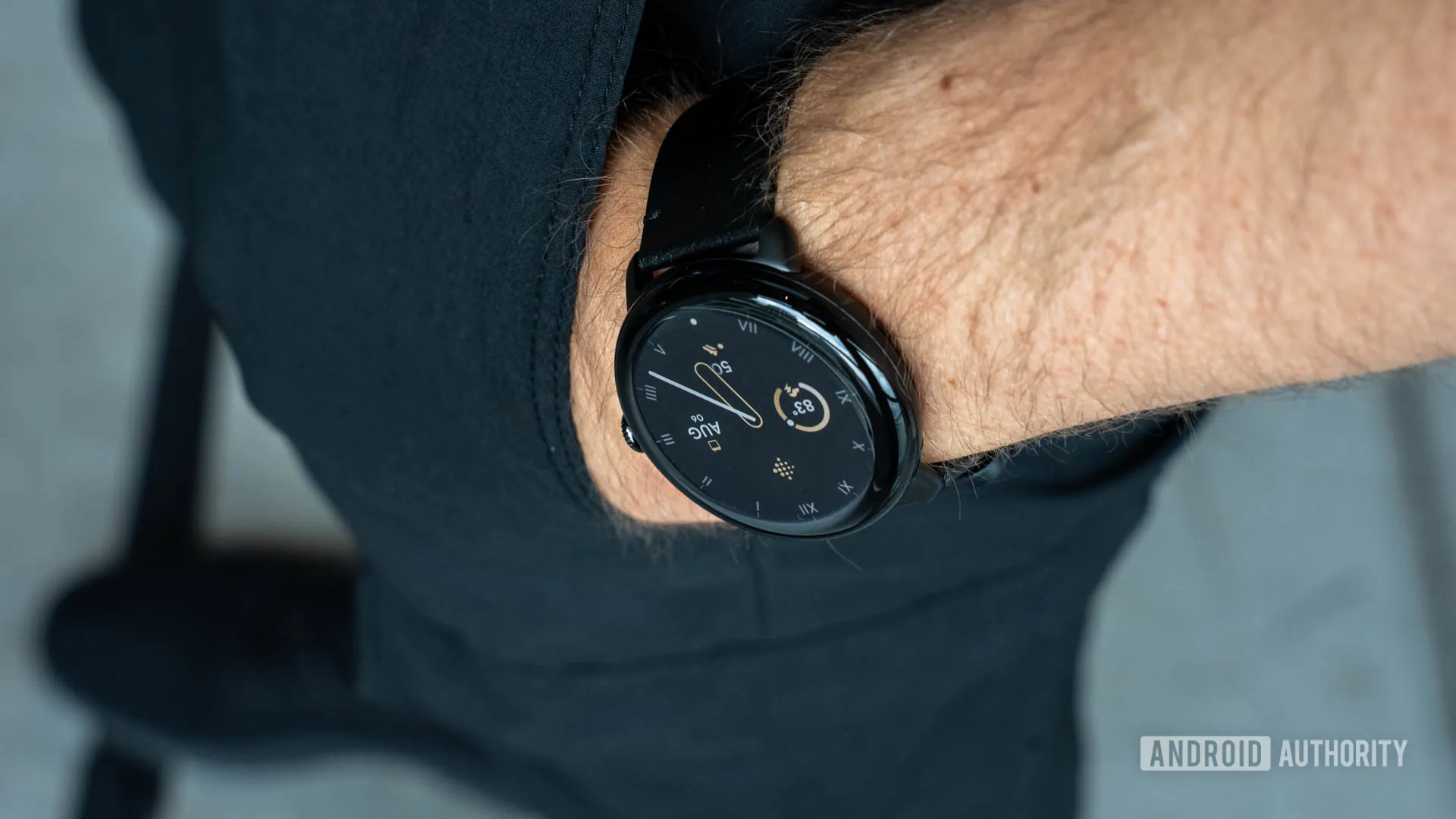 Google-Pixel-Watch-3-in-45mm-size-on-persons-left-wrist-as-it-rests-in-pants-pocket.jpg